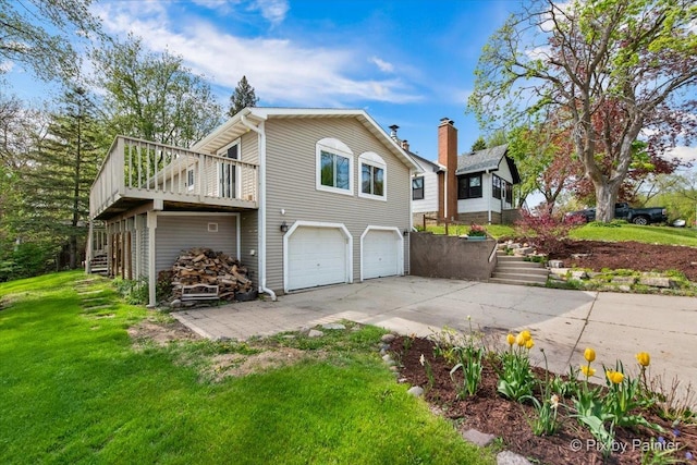 1109 Adams Ave, Wauconda, IL 60084 - view of property exterior with an attached garage, driveway, a yard, and stairway