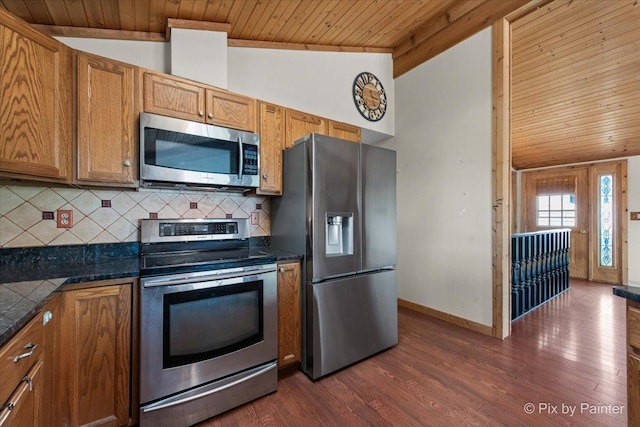 1109 Adams Ave, Wauconda, IL 60084 - kitchen with stainless steel appliances, wooden ceiling, dark countertops, backsplash, and brown cabinets