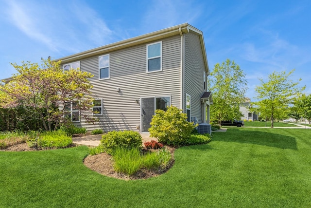 101 Boathouse Rd, Pingree Grove, IL 60140 - rear view of house with a yard and central AC unit