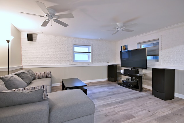741 E Division St, Lombard, IL 60148 - living room featuring ceiling fan, wood finished floors, brick wall, and baseboards