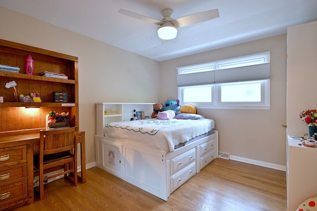 741 E Division St, Lombard, IL 60148 - bedroom featuring light wood-style floors, a desk, baseboards, and a ceiling fan