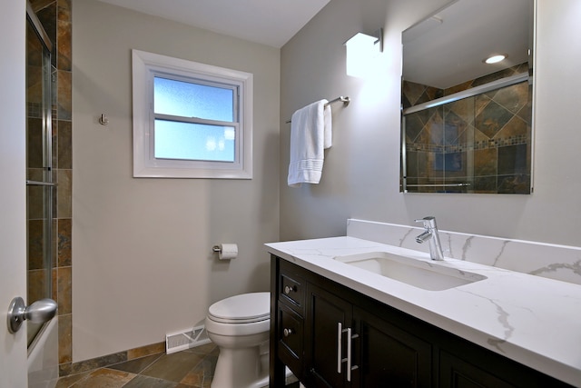 741 E Division St, Lombard, IL 60148 - full bathroom with vanity, baseboards, toilet, and shower / bath combination with glass door