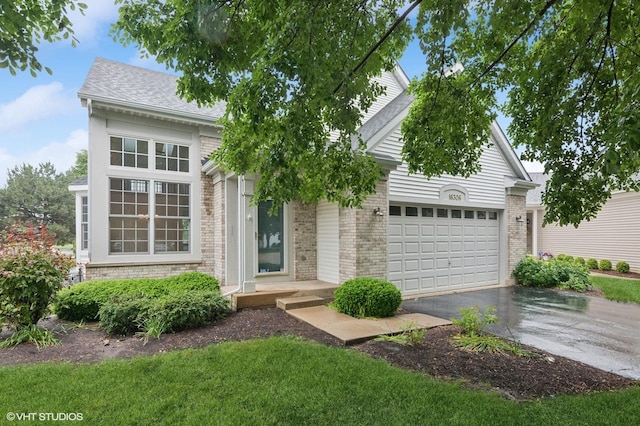 16306 Windsor Lake Ct, Crest Hill, IL 60403 - view of front of home featuring driveway, brick siding, an attached garage, and a shingled roof
