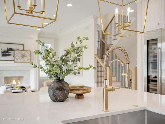 228 S Adams St, Hinsdale, IL 60521 - detailed view of a chandelier, recessed lighting, beverage cooler, a sink, and decorative light fixtures