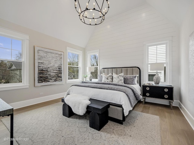 228 S Adams St, Hinsdale, IL 60521 - bedroom with a chandelier, wood finished floors, multiple windows, and high vaulted ceiling