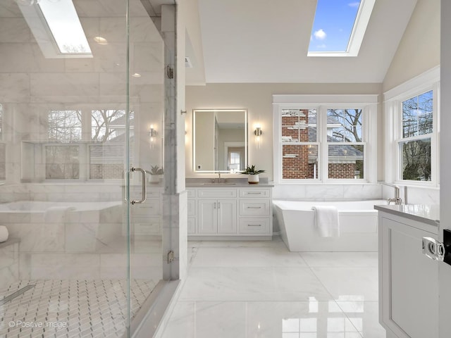 228 S Adams St, Hinsdale, IL 60521 - bathroom featuring a skylight, a stall shower, a freestanding tub, vanity, and lofted ceiling