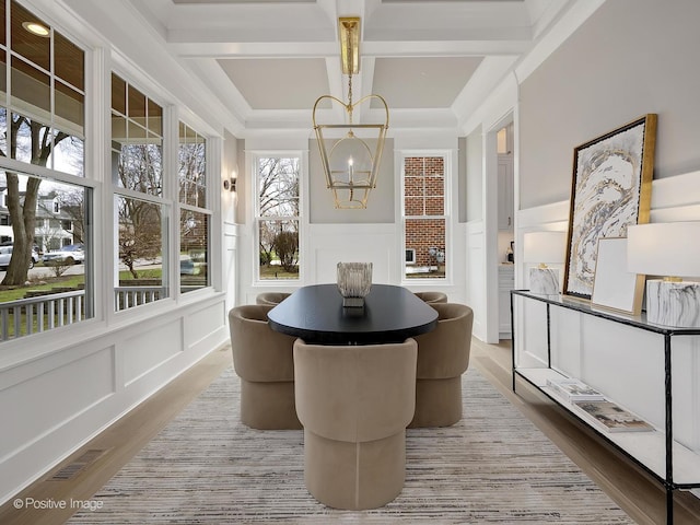 228 S Adams St, Hinsdale, IL 60521 - dining room with a decorative wall, wood finished floors, a chandelier, coffered ceiling, and a wainscoted wall