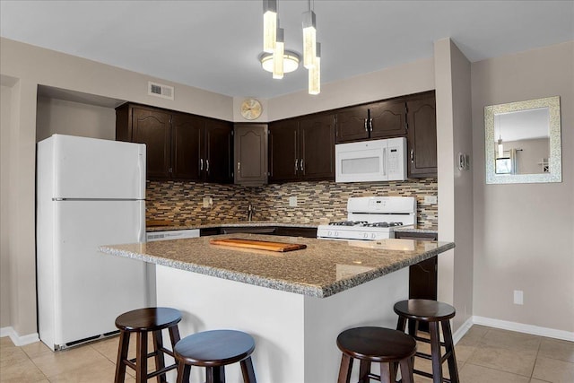 463 Valley Dr Unit 303, Naperville, IL 60563 - kitchen featuring white appliances, dark brown cabinetry, and light tile patterned floors