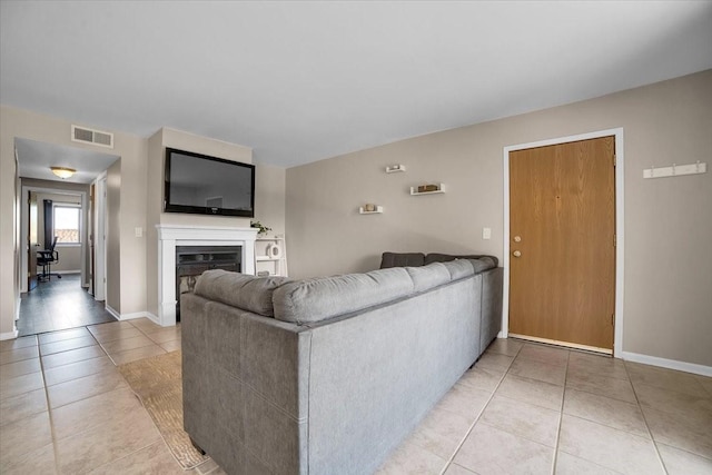 463 Valley Dr Unit 303, Naperville, IL 60563 - living room with light tile patterned flooring, a fireplace, and baseboards
