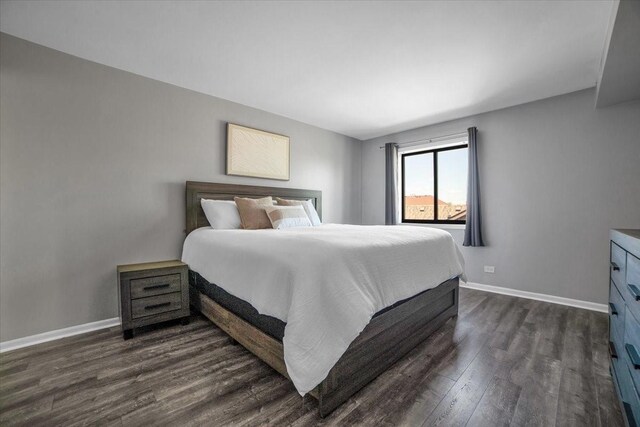 463 Valley Dr Unit 303, Naperville, IL 60563 - bedroom featuring dark wood-style flooring and baseboards