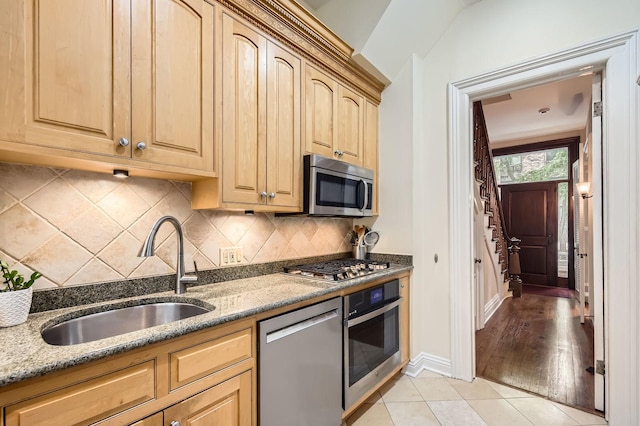 2153 N Sedgwick St, Chicago, IL 60614 - kitchen featuring stainless steel appliances, a sink, light stone countertops, and light brown cabinets