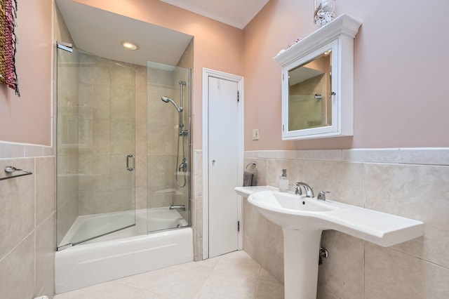 2153 N Sedgwick St, Chicago, IL 60614 - bathroom with tile walls, enclosed tub / shower combo, a wainscoted wall, and tile patterned flooring