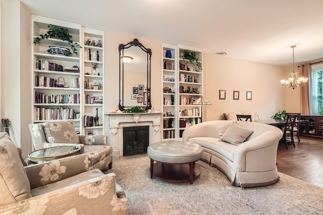 2153 N Sedgwick St, Chicago, IL 60614 - living room featuring a chandelier, a fireplace, and wood finished floors