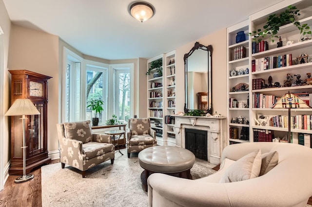 2153 N Sedgwick St, Chicago, IL 60614 - sitting room featuring a fireplace, wood finished floors, and built in shelves
