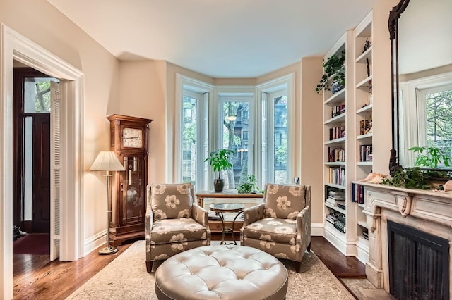2153 N Sedgwick St, Chicago, IL 60614 - sitting room with baseboards, wood finished floors, and a fireplace with flush hearth