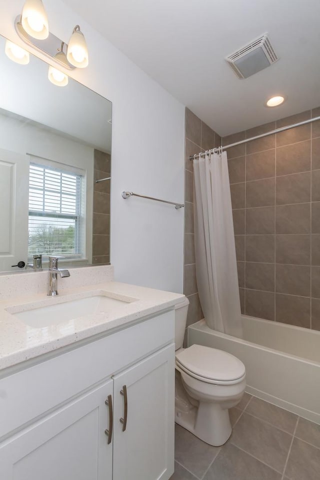 full bath featuring tile patterned floors, shower / bath combo, toilet, vanity, and recessed lighting