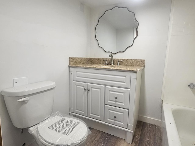 442 Hickory Pl, Elgin, IL 60120 - bathroom with wood finished floors, vanity, toilet, and baseboards