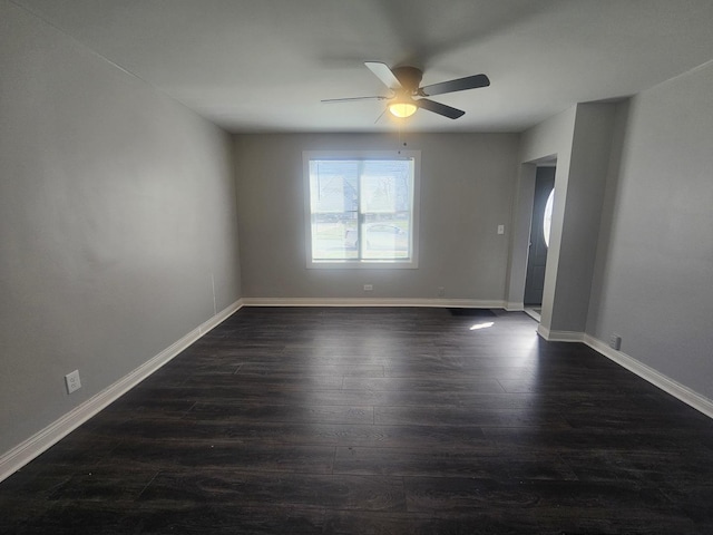 442 Hickory Pl, Elgin, IL 60120 - empty room featuring dark wood-style flooring, ceiling fan, and baseboards
