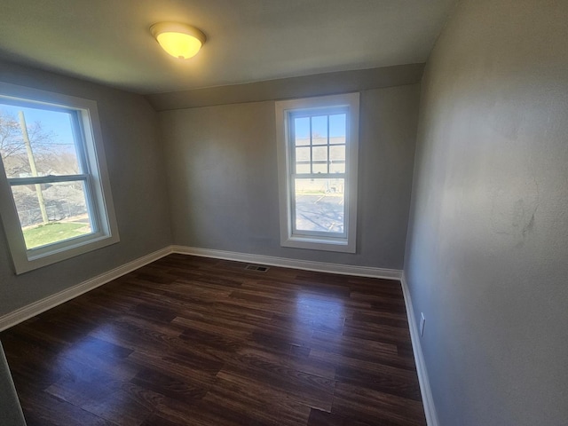 442 Hickory Pl, Elgin, IL 60120 - spare room with healthy amount of natural light, dark wood-type flooring, and baseboards