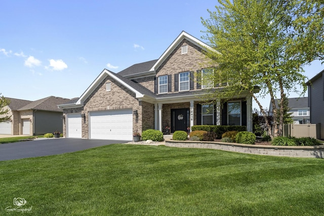 16436 S Mueller Cir, Plainfield, IL 60586 - view of front of house with brick siding, driveway, a garage, and covered porch
