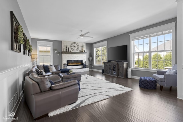 16436 S Mueller Cir, Plainfield, IL 60586 - living area featuring ceiling fan, a fireplace, wood finished floors, and baseboards
