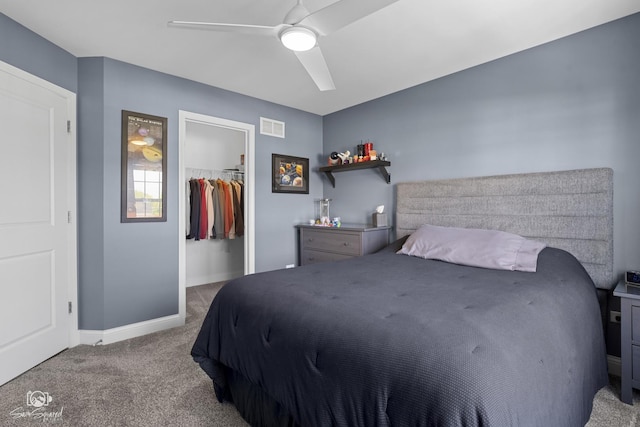16436 S Mueller Cir, Plainfield, IL 60586 - carpeted bedroom with a closet, baseboards, a spacious closet, and ceiling fan