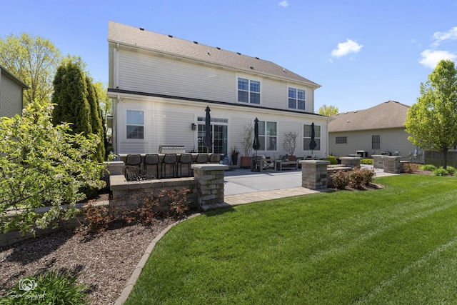 16436 S Mueller Cir, Plainfield, IL 60586 - back of property with a patio, a lawn, exterior kitchen, and exterior bar