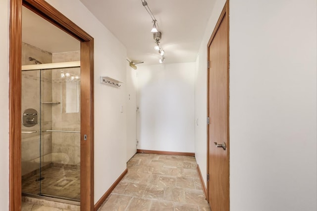 100 E Walton St Unit 25F, Chicago, IL 60611 - hallway with baseboards and light stone finish floors