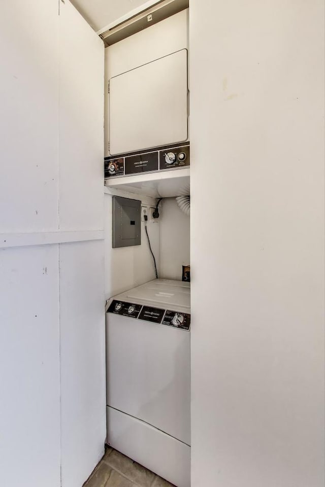 100 E Walton St Unit 25F, Chicago, IL 60611 - laundry room with stacked washing machine and dryer and electric panel
