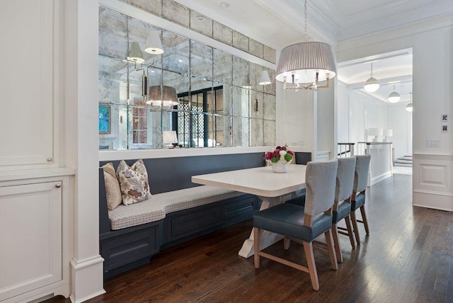 1534 N Dearborn Pkwy, Chicago, IL 60610 - dining room with breakfast area, ornamental molding, a chandelier, dark wood finished floors, and a decorative wall