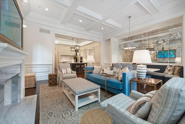 1534 N Dearborn Pkwy, Chicago, IL 60610 - living room featuring a fireplace, crown molding, wood finished floors, beamed ceiling, and coffered ceiling