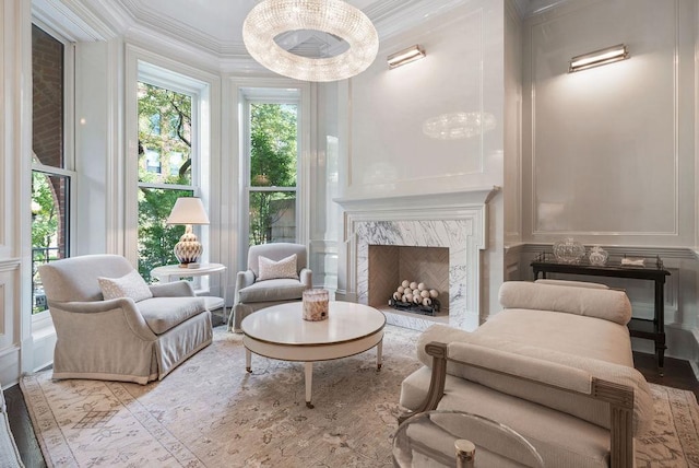 1534 N Dearborn Pkwy, Chicago, IL 60610 - living area with a decorative wall, ornamental molding, wood finished floors, and a fireplace