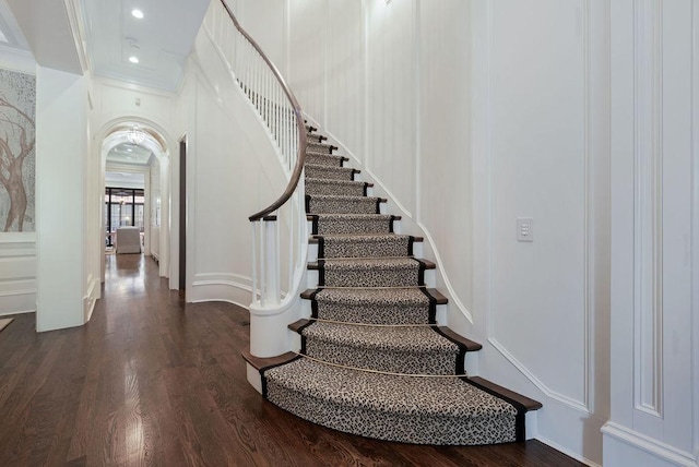 1534 N Dearborn Pkwy, Chicago, IL 60610 - stairs featuring wood finished floors, ornamental molding, arched walkways, and recessed lighting