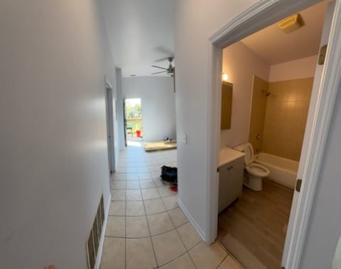 7941 S Woodlawn Ave, Chicago, IL 60619 - hall featuring light tile patterned floors
