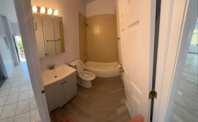 7941 S Woodlawn Ave, Chicago, IL 60619 - bathroom featuring  shower combination, vanity, and toilet