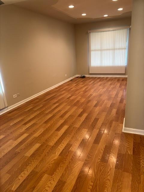 7941 S Woodlawn Ave, Chicago, IL 60619 - empty room with wood finished floors, baseboards, and recessed lighting