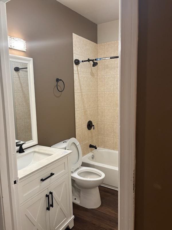 7941 S Woodlawn Ave, Chicago, IL 60619 - bathroom with wood finished floors, vanity,  shower combination, and toilet