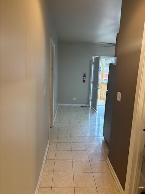 7941 S Woodlawn Ave, Chicago, IL 60619 - hall with light tile patterned flooring and baseboards
