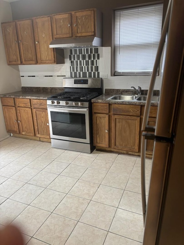 7941 S Woodlawn Ave, Chicago, IL 60619 - kitchen with appliances with stainless steel finishes, a sink, ventilation hood, and dark countertops