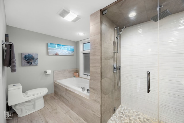 bathroom with a bath, toilet, and a shower stall