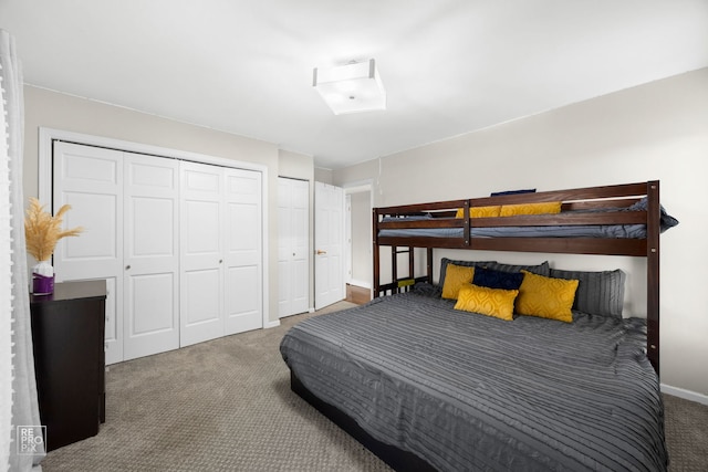 bedroom with carpet flooring and baseboards