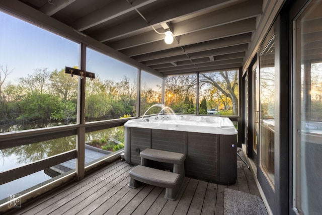 sunroom featuring a hot tub