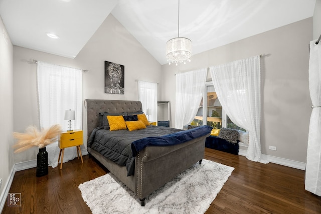 bedroom featuring a chandelier, wood finished floors, baseboards, and lofted ceiling
