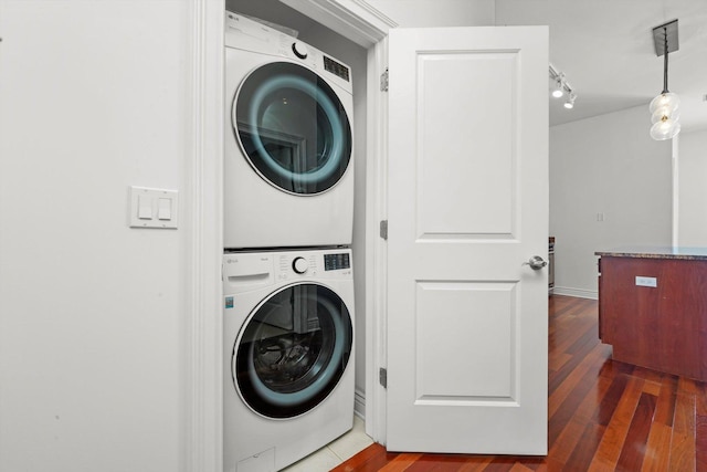 3300 W Irving Park Rd Unit F4, Chicago, IL 60618 - laundry room featuring stacked washing machine and dryer and wood finished floors