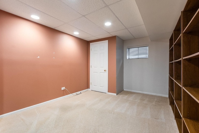 basement featuring light carpet, recessed lighting, and baseboards