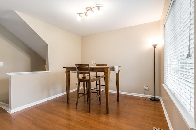 dining room with wood finished floors and baseboards