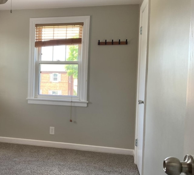 7835 W Berwyn Ave, Chicago, IL 60656 - carpeted empty room featuring baseboards and plenty of natural light