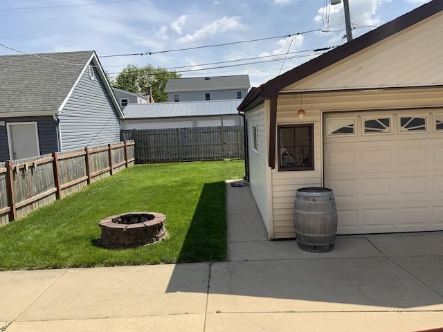7835 W Berwyn Ave, Chicago, IL 60656 - view of yard with an outdoor fire pit and a garage