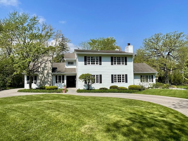 1414 N Ave, Bannockburn, IL 60015 - view of front of property featuring a chimney and a front lawn
