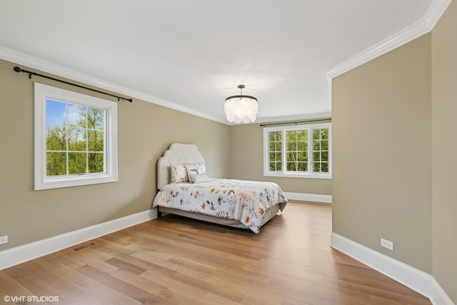 1414 N Ave, Bannockburn, IL 60015 - bedroom with baseboards, crown molding, and light wood-style floors